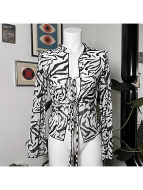 Black & white zebra print blouse with tie front and bell sleeves